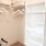 room with hangers and shelf