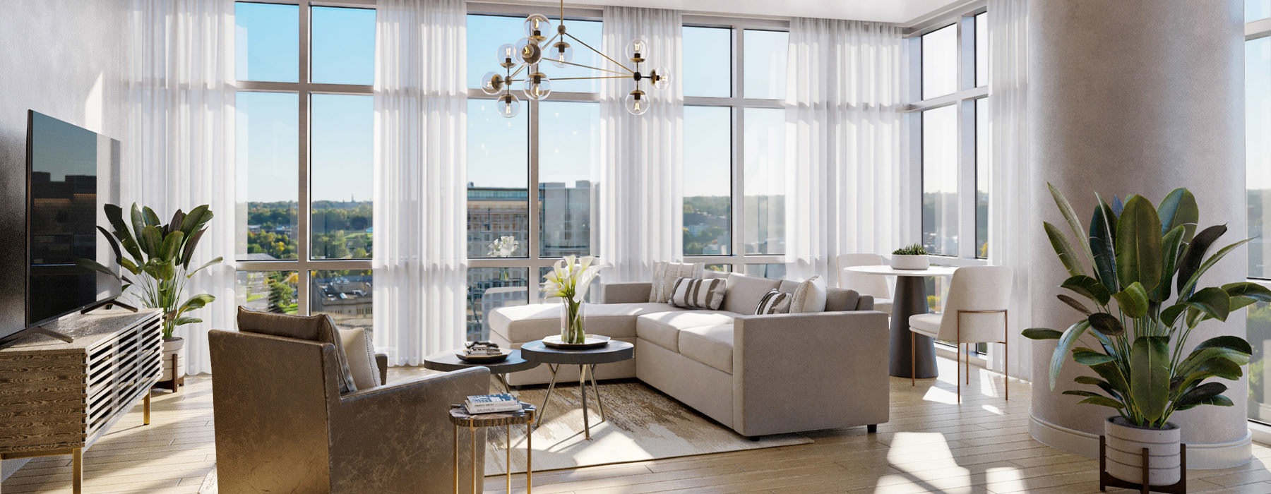 sunlit living room with floor-to-ceiling windows